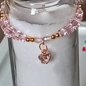 Homemade beaded glass bracelet with charms  Size 7. Color Pink